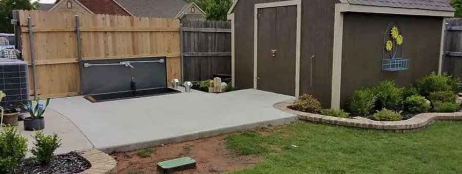 Backyard Patio Top installation beside a shed